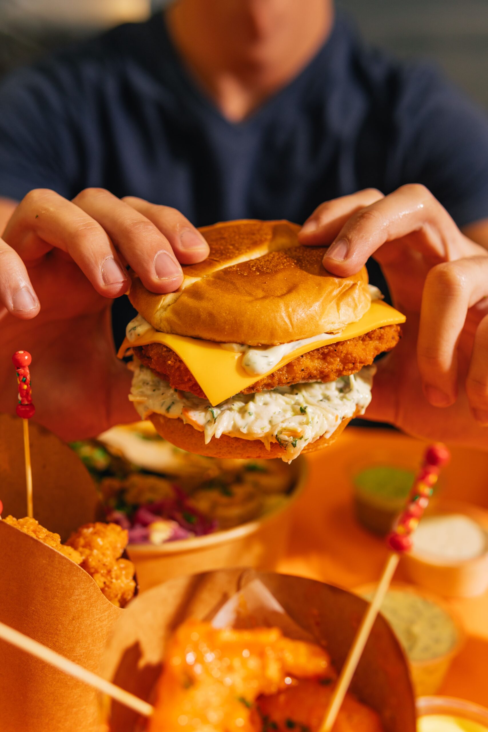 Fish burger in hand